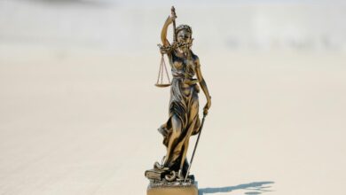 a statue of a person holding a staff