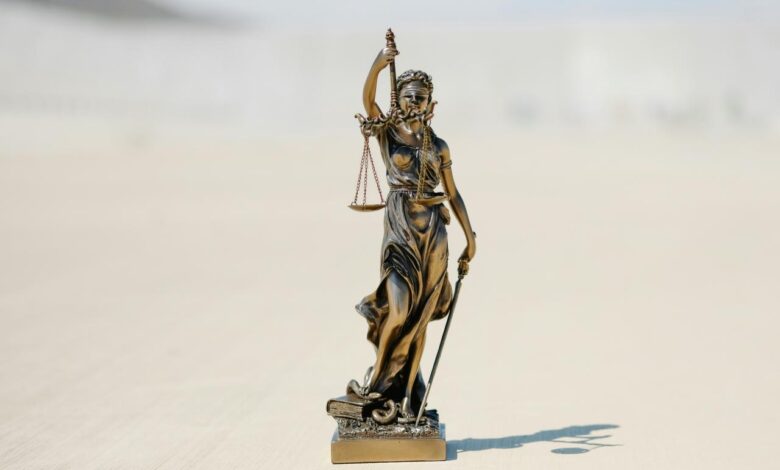 a statue of a person holding a staff